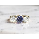 An antique three-stone sapphire and old-cut diamond ring, size L CONDITION REPORT: 2.