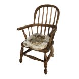 A child's elm Windsor commode armchair, height 63 cm.