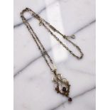 An Edwardian 9ct gold amethyst and garnet pendant on chain CONDITION REPORT: 7.