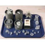 A group of Swarovski and other crystal ornaments, some with boxes.