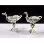 A fine pair of Edward VII Historismus silver cups formed as mythical birds,