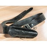A tooled leather gun belt.