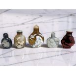 Five Chinese snuff or scent bottles, each carved in relief depicting cockerels, rabbits, tiger, etc,