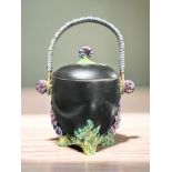 A Clarice Cliff for Wilkinson Limited Bizarre biscuit jar and cover on black ground,