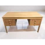 A Scandinavian oak veneer twin pedestal desk,