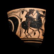 Greek Attic Black-Figure Eye Cup Fragment Depicting Dionysos Riding a Donkey