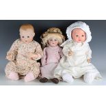 A Halbig K&R bisque head doll with later blonde wig, pierced ears, sleeping blue eyes, open mouth