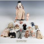 A German porcelain head and shoulders doll with painted features, fabric body and porcelain lower