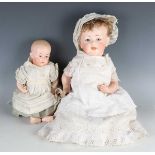 A Kestner bisque head doll, impressed 'J.D.K 211' with blonde wig, sleeping brown eyes, open mouth