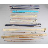 A group of eight fishing rods, including a Hardy Bros Ltd two-piece split cane spinning rod, a Hardy