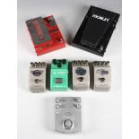 A group of eight guitar pedals, comprising Marshall VT-1, Marshall BB-2, Marshall EH-1, Ibanez