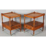 A pair of late 20th century reproduction yew lamp or bedside tables with leather inset tops and