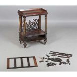 A mid-Victorian rosewood and parcel gilt Canterbury, the galleried top above fluted supports and