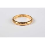 A 22ct gold wedding ring with engraved decoration, Birmingham 1959, weight 3g, ring size approx J1/