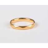 A 22ct gold wedding ring with faceted decoration, London 1961, weight 2.9g, ring size approx I1/2.