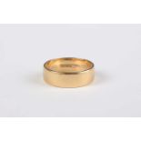 An 18ct gold wide band wedding ring, London 1980, weight 5.4g, ring size approx N.