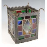 An early 20th century metal framed hanging hall lantern, inset with stained glass panels, height