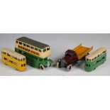 Four pre-war Dinky Toys vehicles, comprising No. 29c double-decker bus in cream and green with