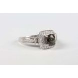 A white gold, natural alexandrite and diamond ring, claw set with the cushion cut alexandrite within