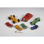 Seven pre-war Dinky Toys cars, comprising No. 30a Chrysler Airflow in red with plated hubs, No.