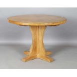 A Robert 'Mouseman' Thompson oak circular supper table, the adzed top on a quatreform base bearing