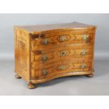 A mid-18th century Italian walnut three-drawer commode with crossbanded borders and inlaid pollarded