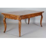 A late 19th century French chestnut farmhouse table, the thick four-plank top with cleated ends