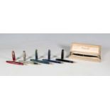 A group of six fountain pens, including a Waterman Ideal (crack to cap), five Parkers, and a