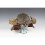 A Japanese suji kabuto, mid-Edo period, the steel skull body divided into thirty-six gilt finished