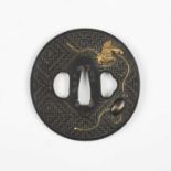 A very fine Japanese oval shakudo-inlaid bronze tsuba, Edo period, with basketweave decorated base