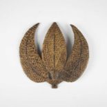 A rare Japanese embossed leather and lacquer-finished sashimono or temporary banner emblem in the