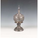 A Burmese silver centrepiece bowl and cover, late 19th century, the circular body, domed cover and