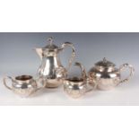 A Chinese silver four-piece tea set by Tien Shing, late 19th century, comprising teapot, hot water