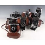 A collection of assorted cameras, including three Zeiss Ikon Ikontas, Voigtländer Vito-B, Zeiss Ikon