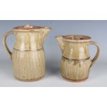Two Richard Batterham studio pottery ash glazed stoneware coffee pots and covers, the first with