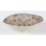 A Mary Rogers porcelain small flared bowl, painted to the interior with a closely packed pattern