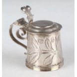 A James II miniature toy silver tankard with stepped hinged lid and shaped thumbpiece, the tapered