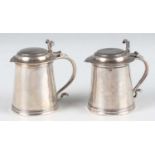 A pair of Queen Anne miniature toy Britannia standard silver tankards, each with domed hinged lid,
