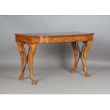 A Victorian satinwood bowfront writing table, stamped 'Gillow & Co 57' to drawer, the top inset with