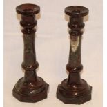 A pair of Cornish green and red serpentine tapered candlesticks with octagonal bases,