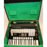 A Hohner Tango 1VS digital piano accordion in fitted case