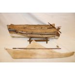 An old East African wooden model boat with cotton sail,