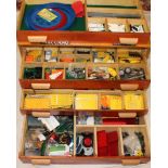 A modern four drawer wooden chest containing a large selection of good quality modern Meccano