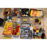 Numerous boxes containing a selection of modern Meccano including parts, gears, wheels,