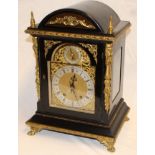 A good quality bracket clock with silvered and gilt arched dial in gilt mounted ebonised