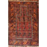 An old Eastern hand-knotted wool prayer rug with geometric decoration on purple ground,