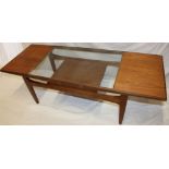 A 1960s G-Plan teak rectangular two-tier coffee table with inset glass top,