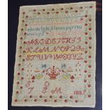 A Victorian rectangular needlework sampler depicting alphabet and symbols by Susan Oglesby aged 9 -