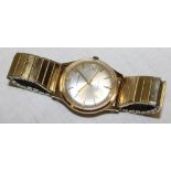 A gentleman's 9ct gold wrist watch by Garrard with expanding strap