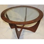 A 1960s G-Plan teak circular glass top coffee table